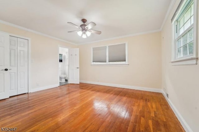 7 Swan Ter, Wayne Twp, NJ 07470 - unfurnished bedroom with wood finished floors, baseboards, ornamental molding, a closet, and ensuite bath
