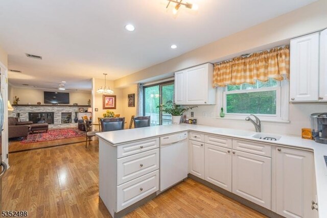8 Kevin Dr, Mount Olive Twp, NJ 07836 - kitchen featuring white dishwasher, a peninsula, white cabinetry, light countertops, and recessed lighting