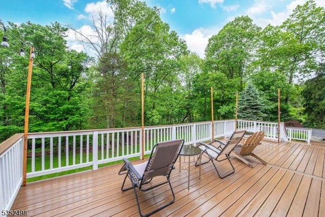 8 Kevin Dr, Mount Olive Twp, NJ 07836 - deck featuring view of wooded area