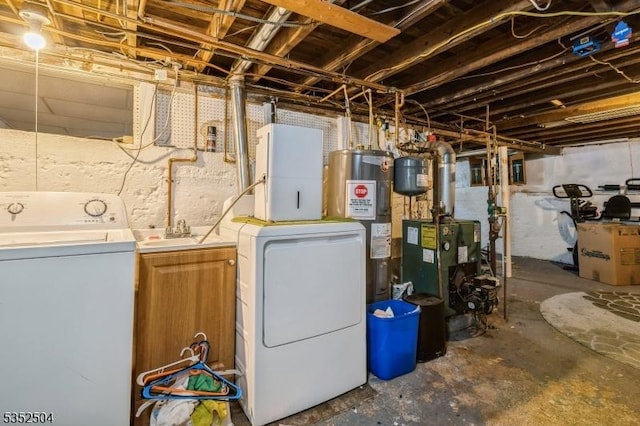 unfinished below grade area featuring water heater, a heating unit, and washing machine and dryer