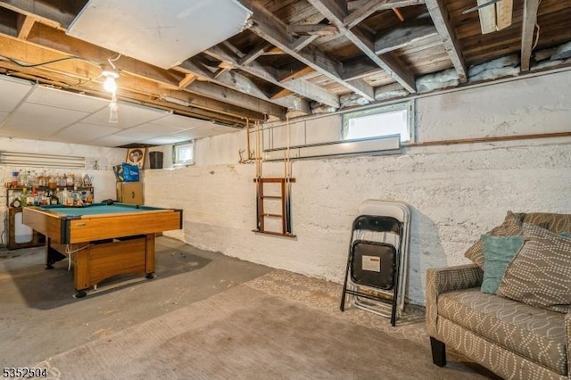playroom featuring plenty of natural light, concrete flooring, and pool table