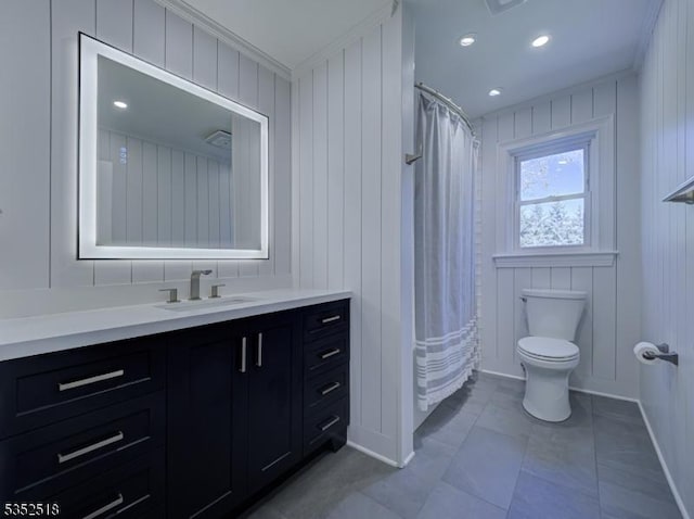 full bathroom featuring toilet, crown molding, vanity, tile patterned flooring, and curtained shower
