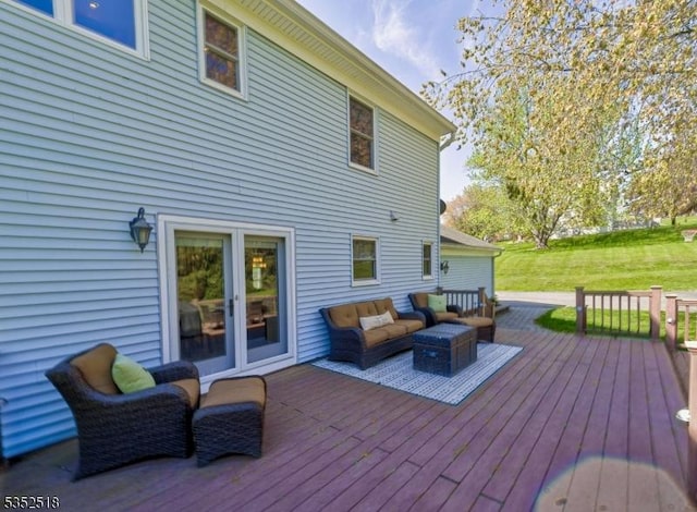 deck featuring an outdoor hangout area and a yard