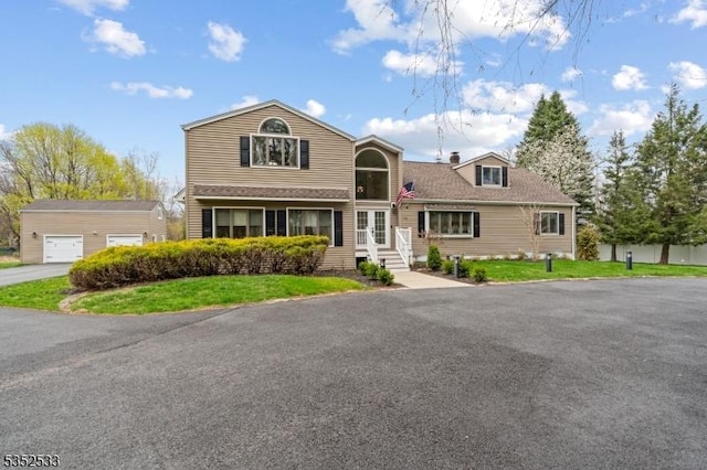 view of front of home featuring french doors and a front yard