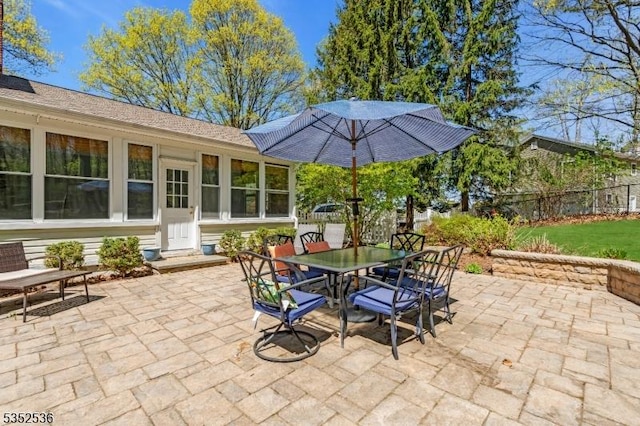 view of patio / terrace featuring fence and outdoor dining space