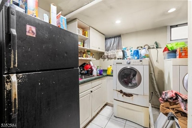 laundry room featuring light tile patterned floors, washer / dryer, and recessed lighting
