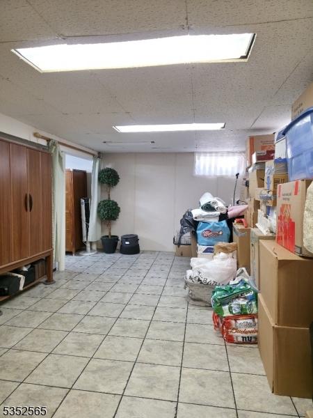 below grade area featuring light tile patterned floors