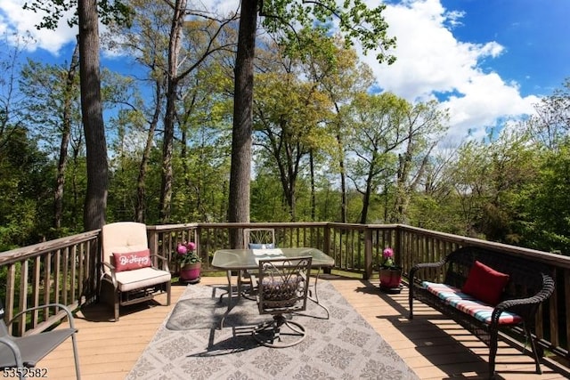 deck featuring outdoor dining area
