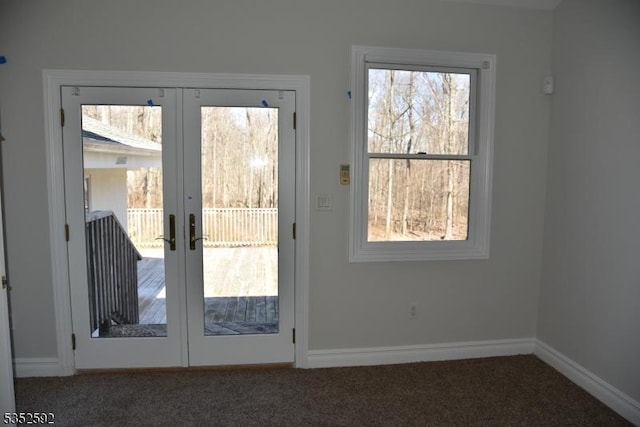doorway to outside featuring baseboards, french doors, and carpet