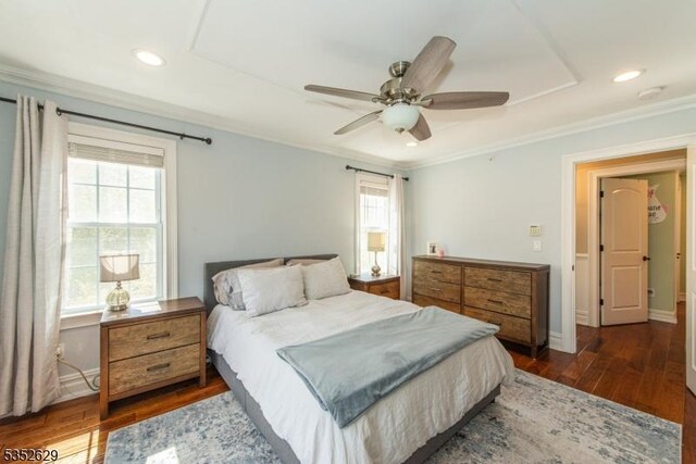 bedroom featuring recessed lighting, multiple windows, ornamental molding, and dark wood-style floors