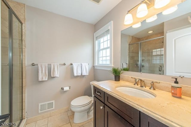 full bath featuring tile patterned flooring, vanity, toilet, a shower stall, and visible vents