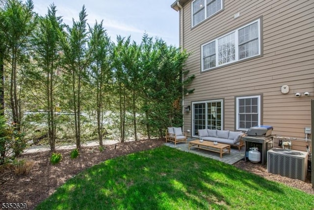 view of yard with an outdoor hangout area, cooling unit, and a patio area