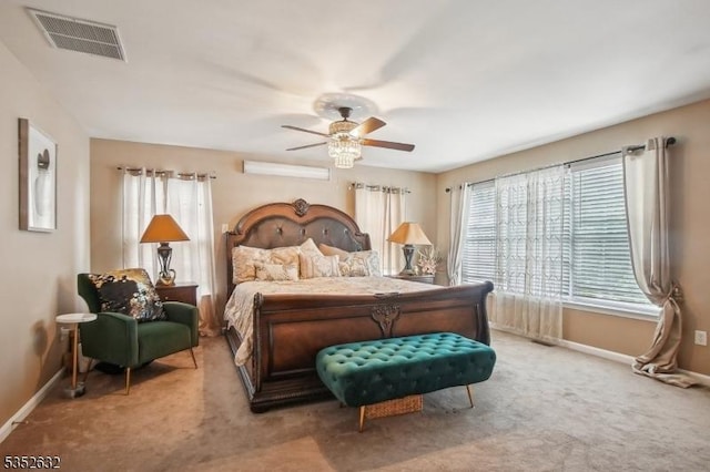 bedroom featuring multiple windows, baseboards, and carpet