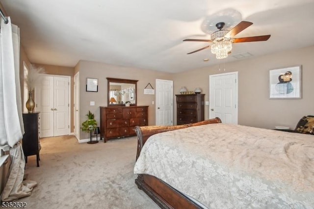 bedroom with light carpet, ceiling fan, and baseboards