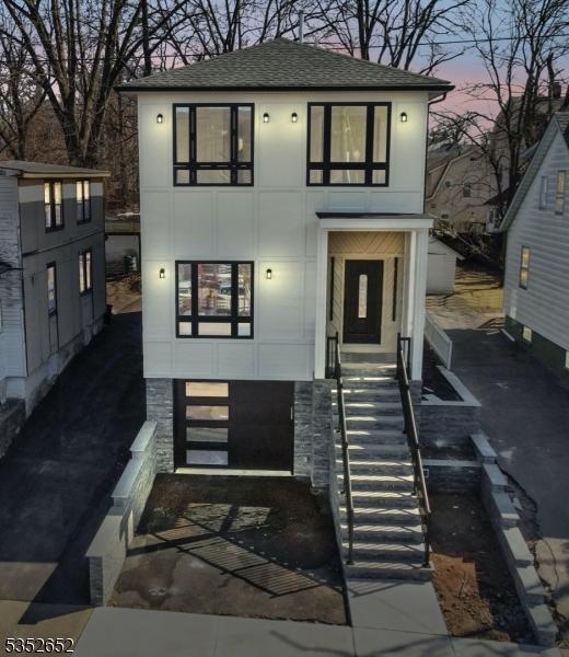 784 Valley St, Union Twp, NJ 07088 - view of front of house with stairs and a shingled roof