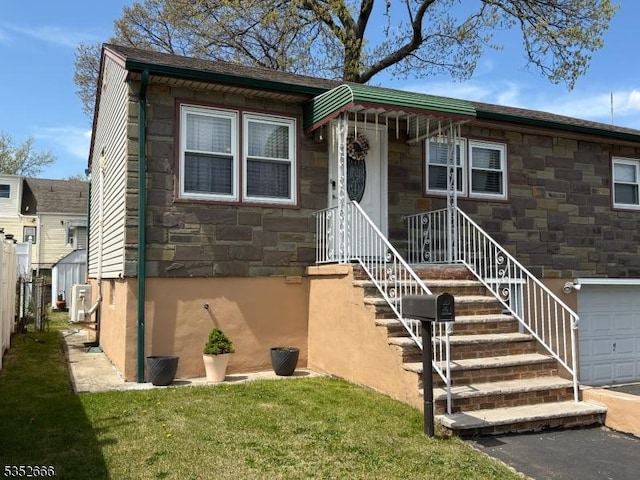 view of front of property with a front lawn and stone siding