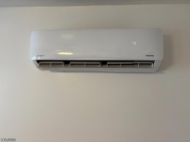 details featuring a wall mounted air conditioner
