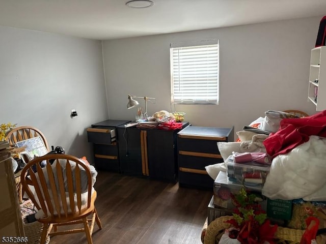bedroom with dark wood-style flooring
