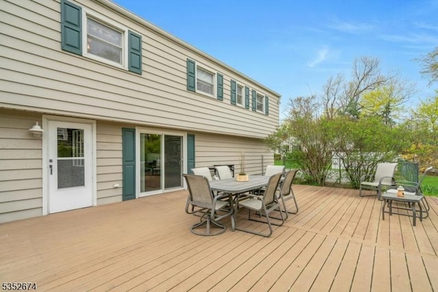 wooden deck with outdoor dining space