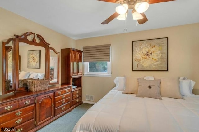 bedroom with dark carpet and visible vents