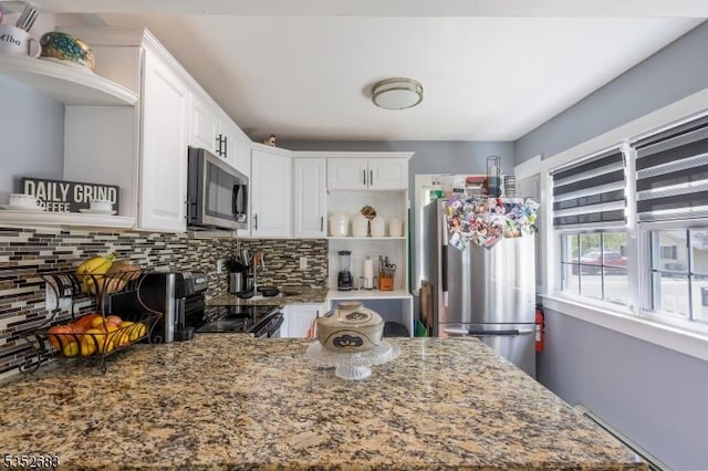 kitchen featuring white cabinets, open shelves, appliances with stainless steel finishes, stone counters, and tasteful backsplash