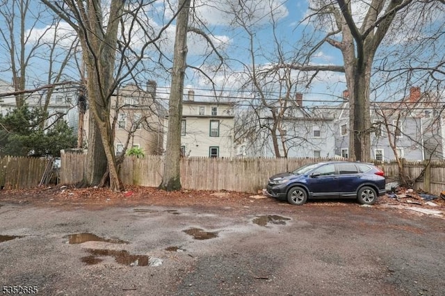 view of front of property featuring fence and a chimney