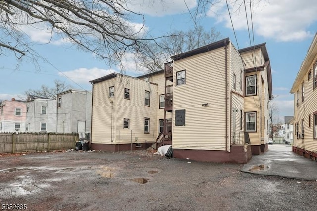 rear view of house with fence