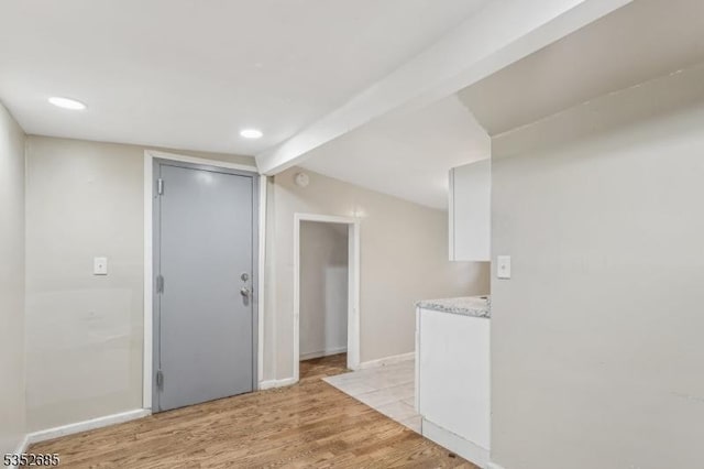 interior space with light wood-style floors, baseboards, and recessed lighting