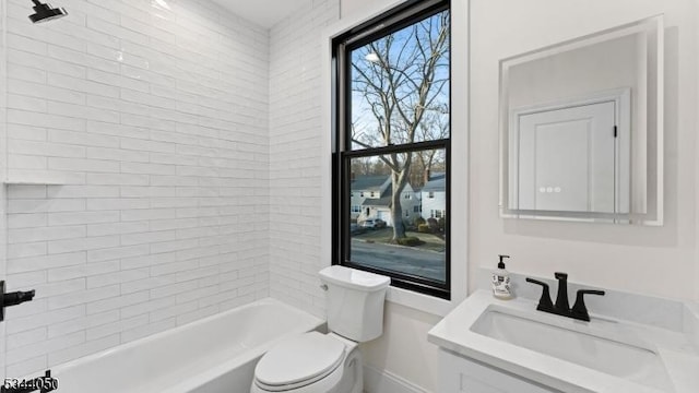 bathroom featuring shower / bathtub combination, baseboards, vanity, and toilet