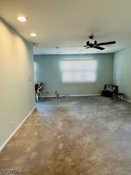 carpeted empty room featuring recessed lighting, a ceiling fan, and baseboards