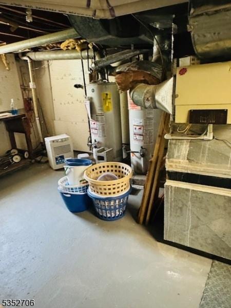 utility room featuring water heater