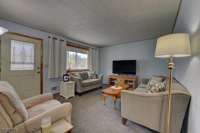 carpeted living area with visible vents