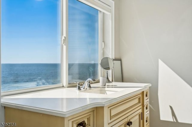 bathroom featuring a water view and vanity