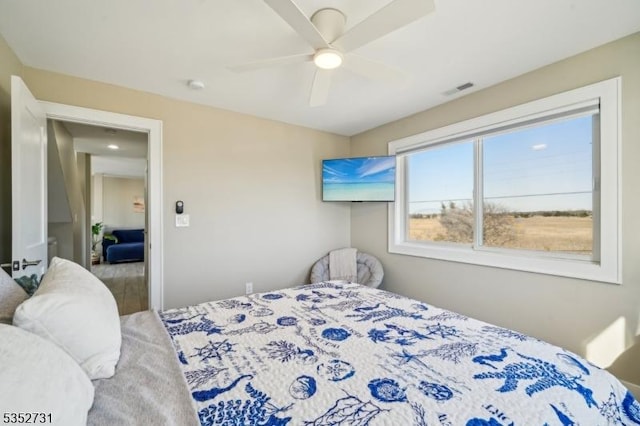 bedroom featuring visible vents and a ceiling fan
