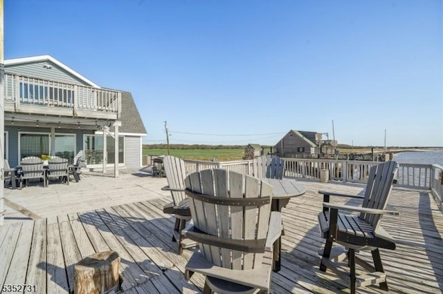 deck featuring outdoor dining area