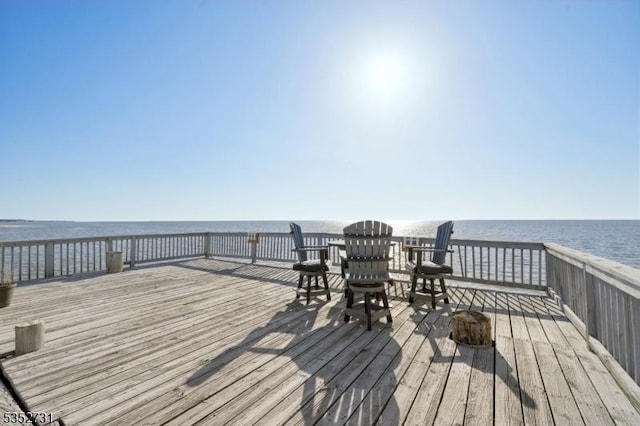 wooden deck with a water view