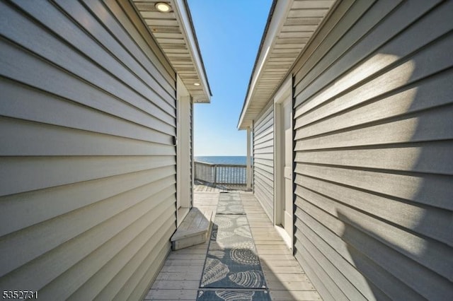 view of side of home featuring a water view