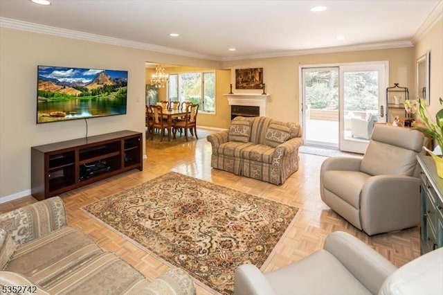living room featuring ornamental molding, recessed lighting, a notable chandelier, and baseboards