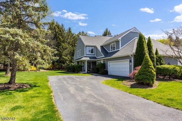 view of front of home with a front lawn and driveway