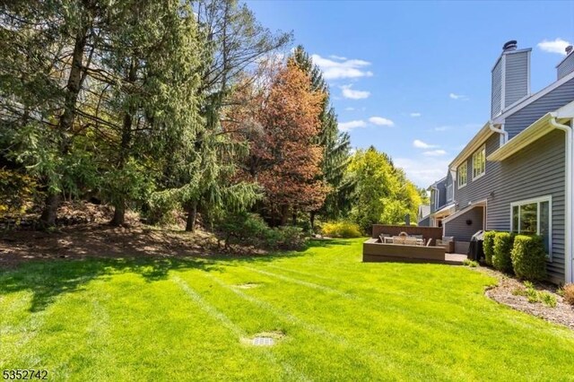 view of yard with a wooden deck