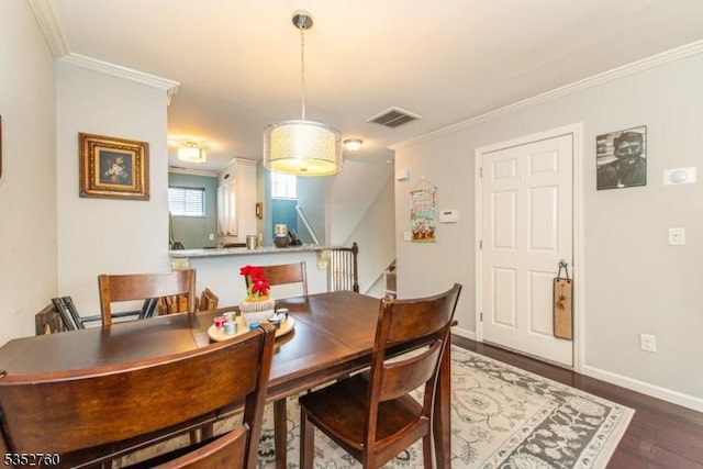 dining area with dark wood finished floors, stairs, baseboards, visible vents, and crown molding