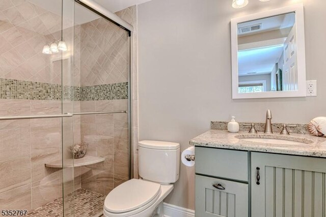 2210 Atlantic Ave, Long Beach Twp, NJ 08008 - bathroom with toilet, a shower stall, and vanity