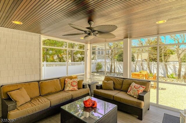2210 Atlantic Ave, Long Beach Twp, NJ 08008 - sunroom / solarium with a ceiling fan and an outdoor living space