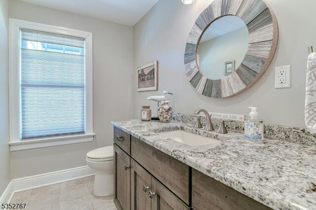 2210 Atlantic Ave, Long Beach Twp, NJ 08008 - bathroom with baseboards, tile patterned flooring, vanity, and toilet