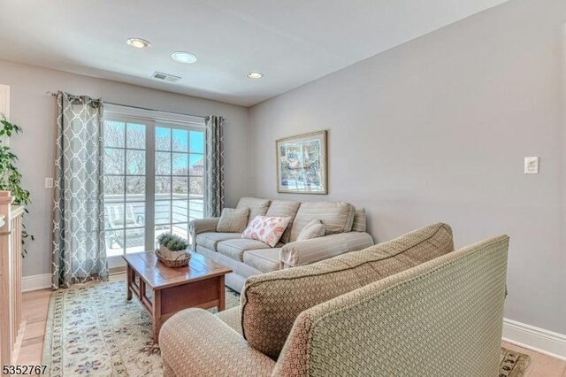 2210 Atlantic Ave, Long Beach Twp, NJ 08008 - living room featuring recessed lighting, baseboards, visible vents, and light wood-type flooring