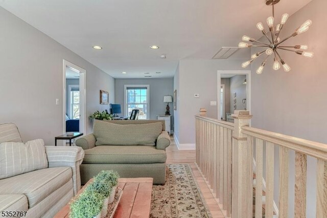 2210 Atlantic Ave, Long Beach Twp, NJ 08008 - living room featuring recessed lighting, light wood finished floors, and a chandelier