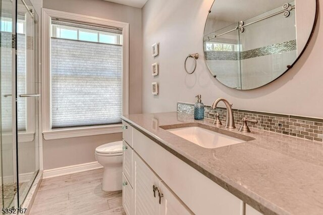 2210 Atlantic Ave, Long Beach Twp, NJ 08008 - full bath with vanity, baseboards, a shower stall, and toilet