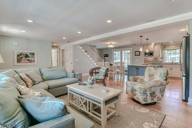 2210 Atlantic Ave, Long Beach Twp, NJ 08008 - living room featuring a healthy amount of sunlight, recessed lighting, and stairs