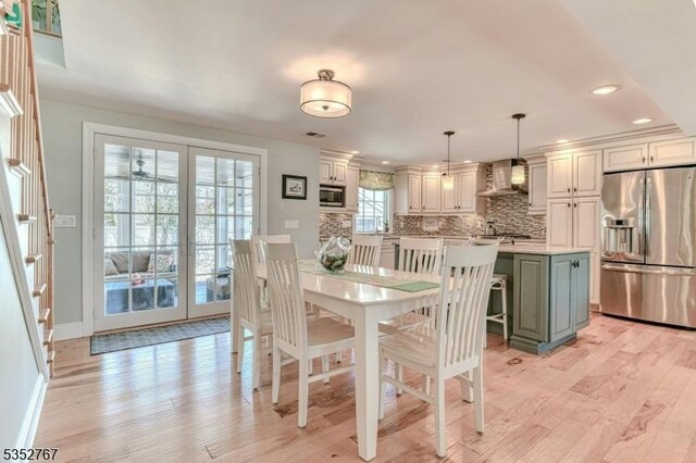2210 Atlantic Ave, Long Beach Twp, NJ 08008 - dining space with recessed lighting, baseboards, french doors, and light wood finished floors