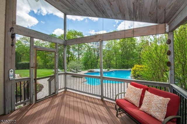 sunroom with view of scattered trees